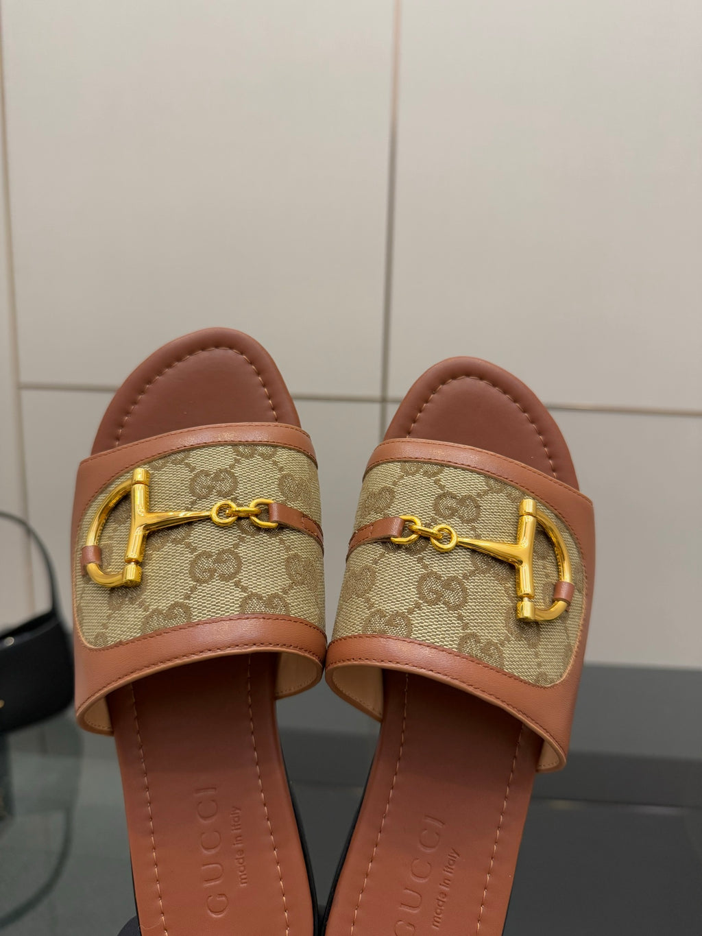 Gucci ladies slide sandals, GG canvas band with gold buckle and tan leather edges
