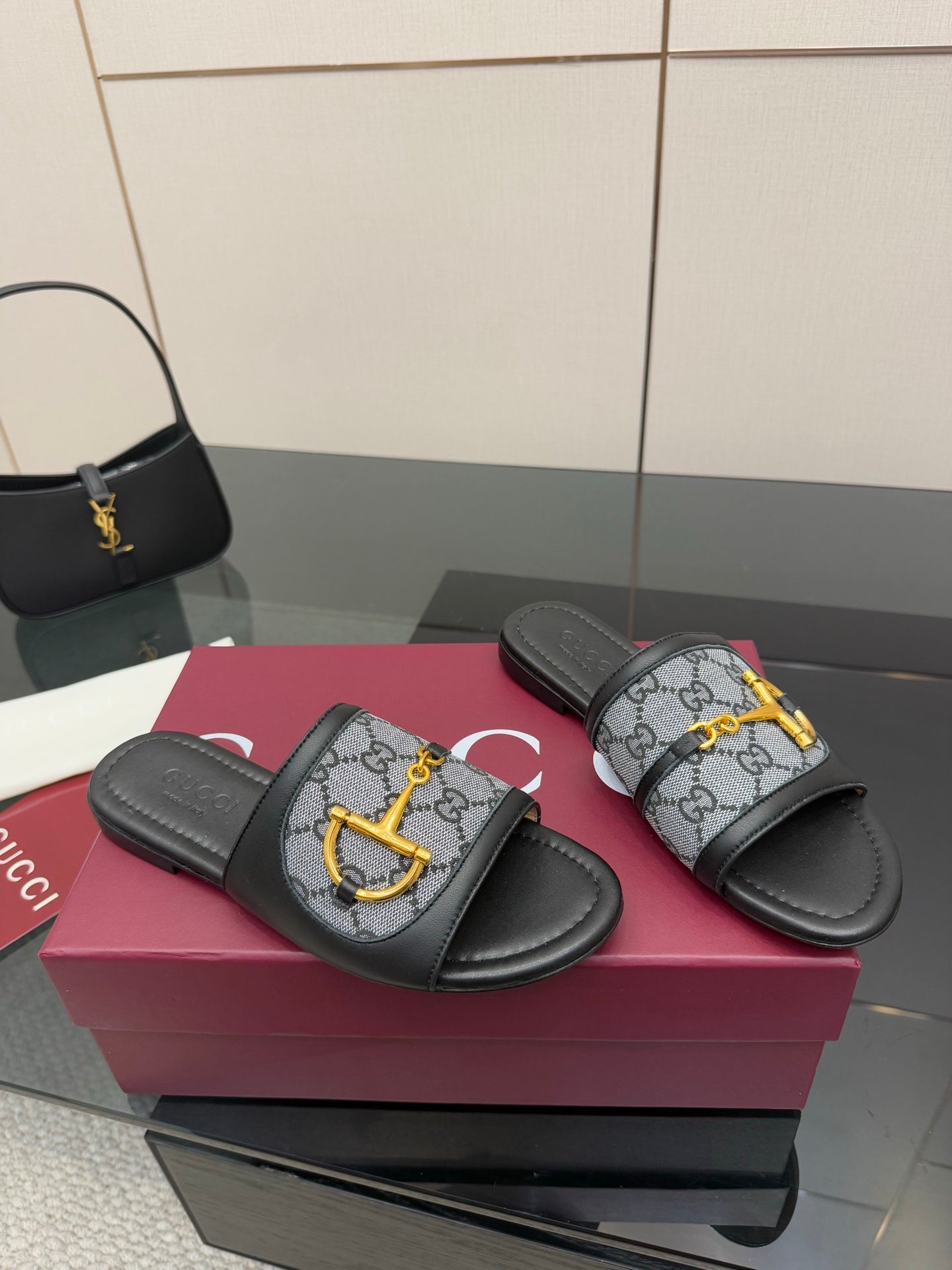 Gucci ladies slide sandals, gray GG print strap with yellow logo hardware, black footbeds