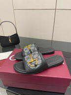 Gucci ladies slide sandals with black leather straps and gray GG canvas with yellow bit detail