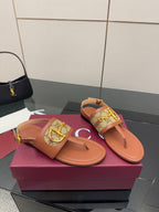 Gucci ladies thong sandals with tan footbed and patterned strap, gold buckle detail