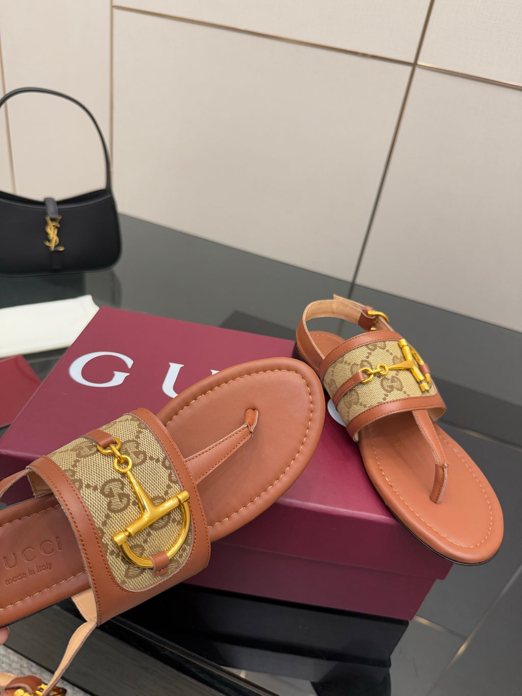 Gucci ladies thong sandals, tan footbed and patterned strap with gold D-ring buckle