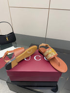 Gucci ladies thong sandals, tan footbed and logo patterned strap with gold buckle
