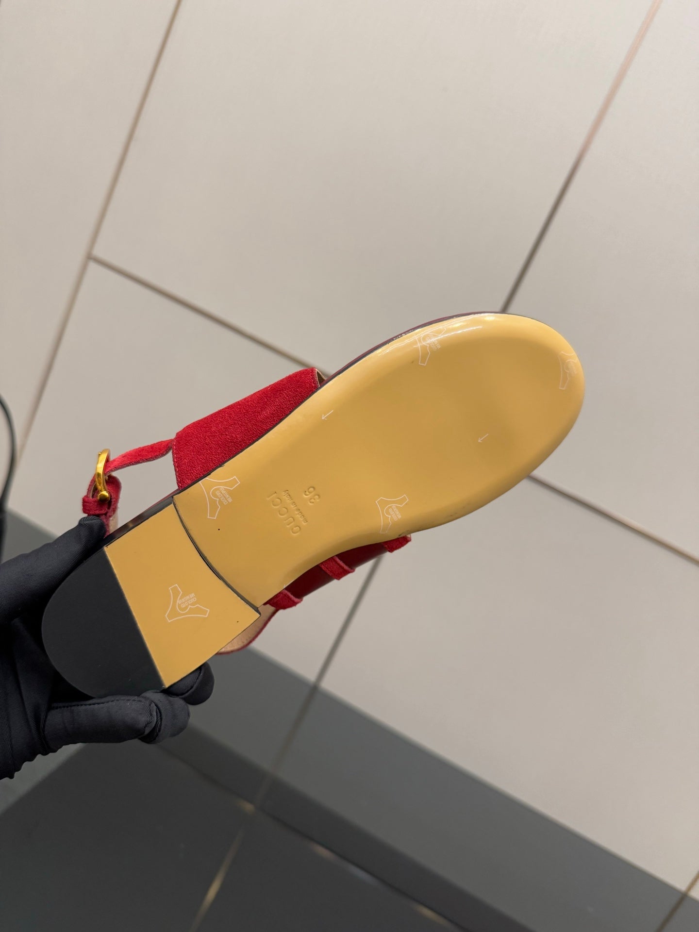 Gucci red sandals outsole view with tan bottom and red upper