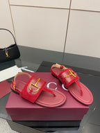 Gucci red thong sandals with gold-tone buckle hardware