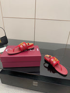 Gucci red slide sandals with gold-tone buckle detail, open toe
