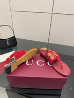 Gucci red flat sandals with gold-tone horsebit bar on strap