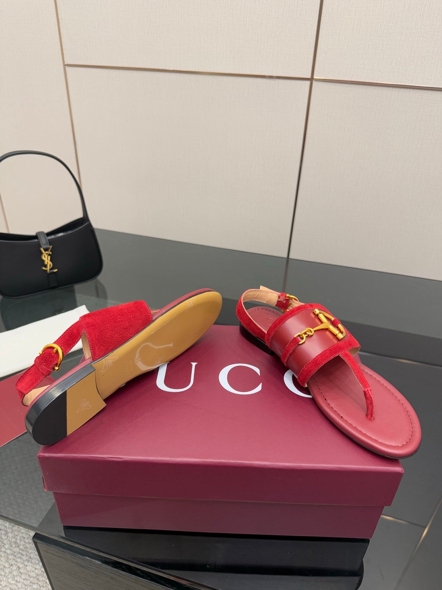 Gucci red flat sandals with gold-tone horsebit bar on strap