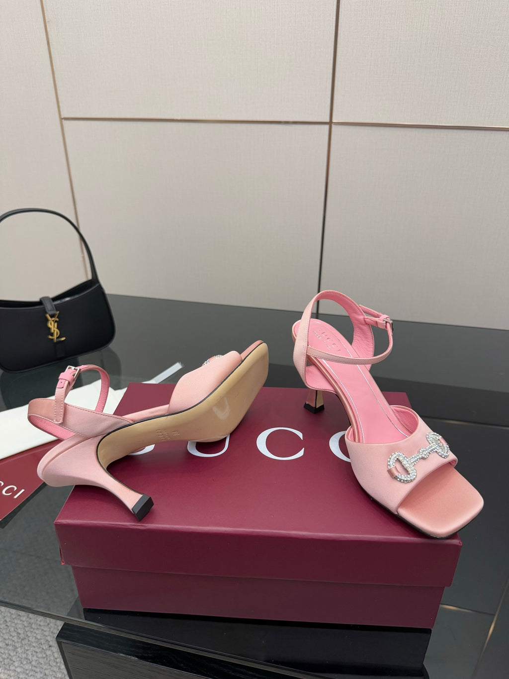Pink slingback heeled sandals with open toe and jeweled buckle ornament