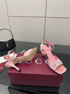 Pink slingback heeled sandals with open toe and jeweled buckle ornament