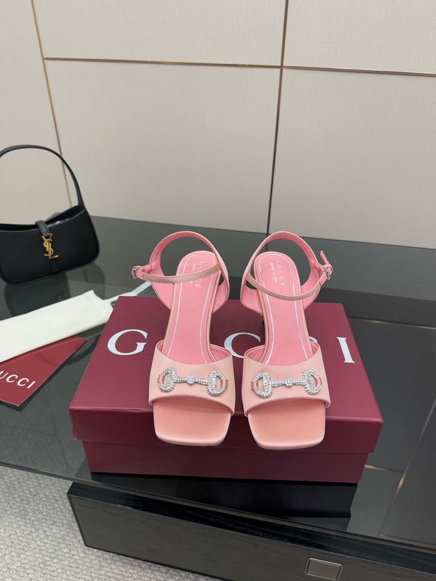 Pink women's heeled sandals with open toe and embellished buckle strap