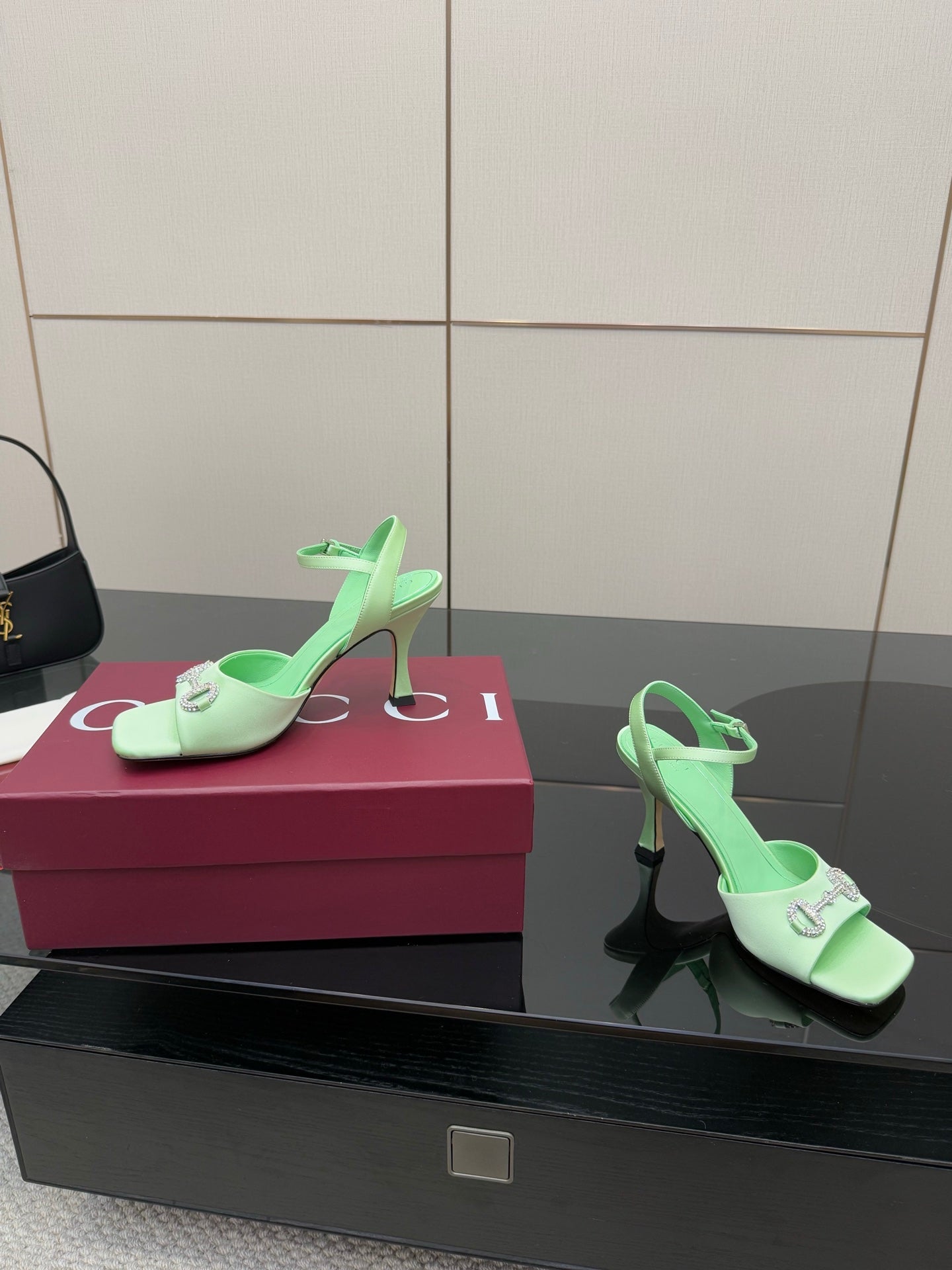 Mint green slingback heeled sandals with rhinestone buckle and stiletto heels