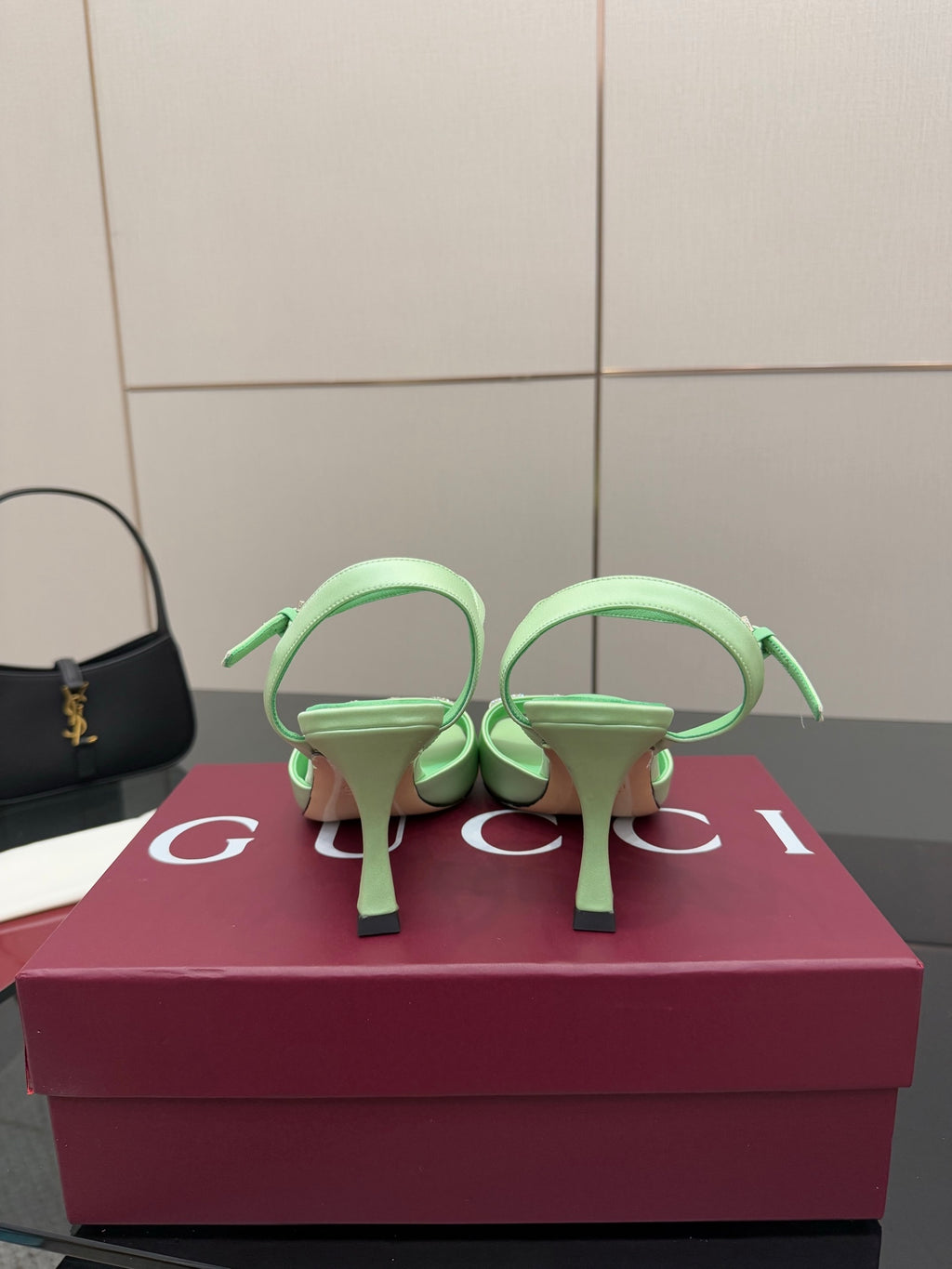 Mint green slingback heeled sandals showing back ankle straps and stiletto heels