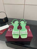 Mint green heeled sandals with rhinestone buckle, slingback straps, stiletto heels