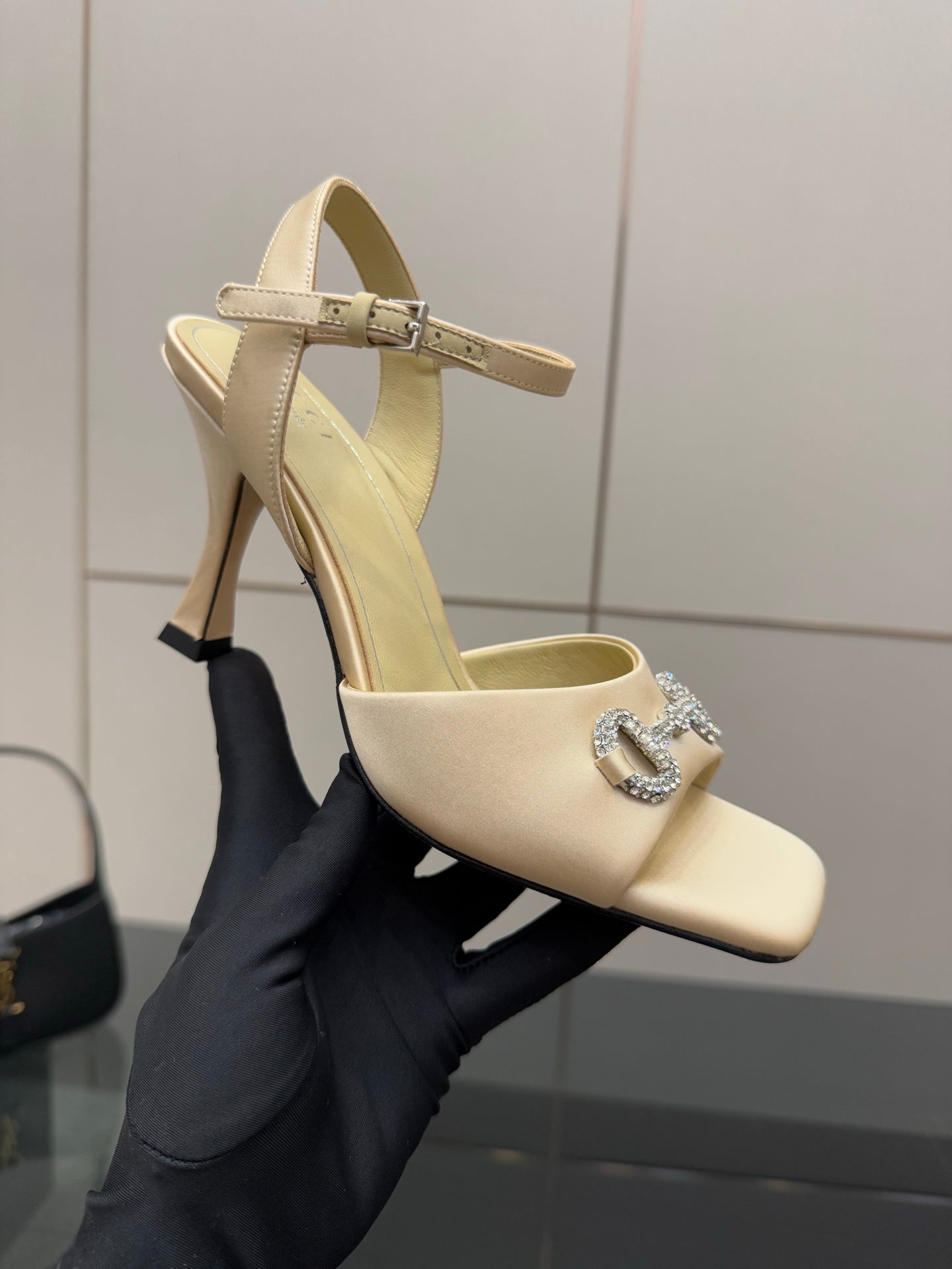 Gucci ladies cream slingback heel with rhinestone buckle on front strap