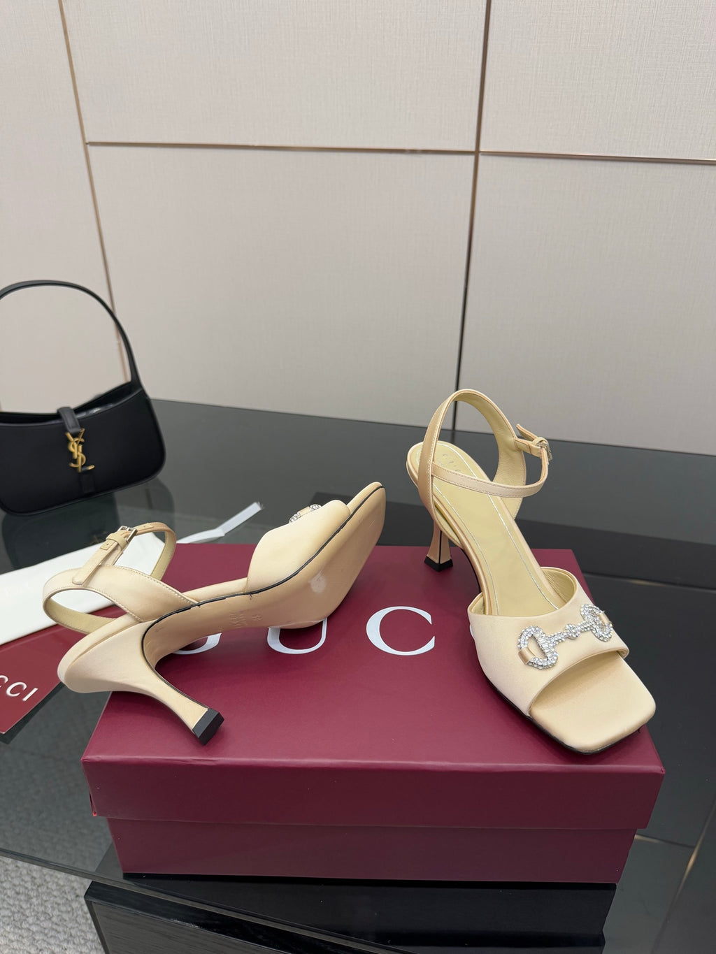 Gucci ladies cream slingback heels with pointed toe and rhinestone buckle detail