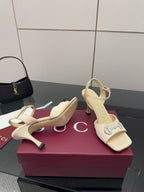 Gucci ladies cream slingback heels with pointed toe and rhinestone buckle detail