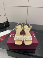 Gucci ladies cream slingback heels with decorative rhinestone buckle on strap