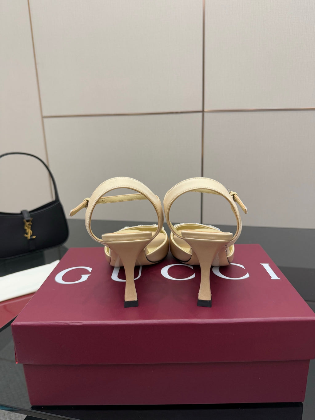 Gucci ladies cream slingback heels shown from back with stiletto heel and strap