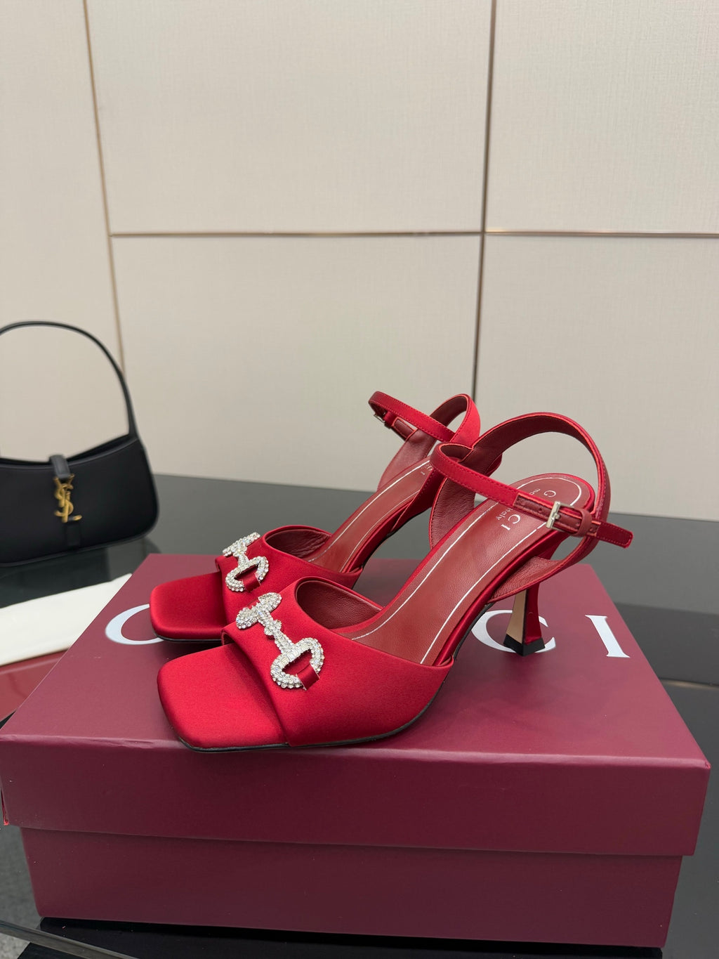 Red Gucci slingback heels with rhinestone horsebit buckle and ankle strap