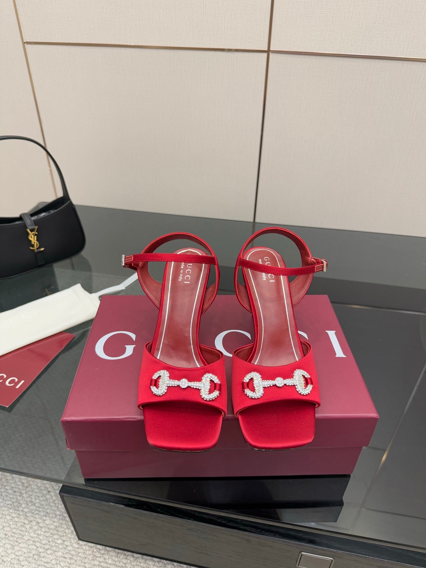 Red Gucci ladies heeled sandals with rhinestone horsebit detail and ankle strap