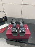 Gucci ladies open-toe heeled sandal in black with silver-tone logo detail