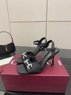 Gucci ladies open-toe heeled sandal with black straps and silver-tone logo buckle