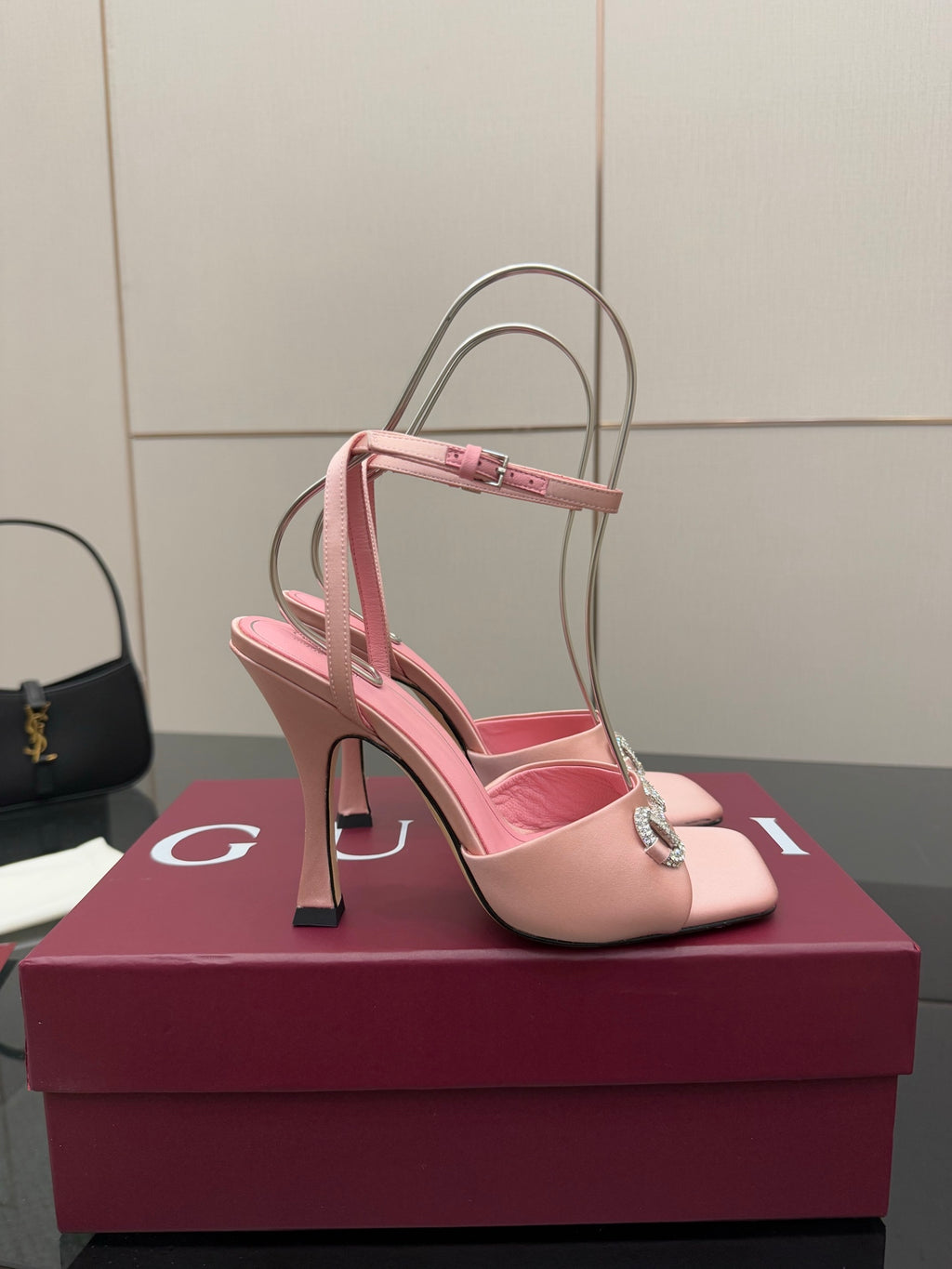 Gucci ladies pink satin heels with open toe, rhinestone buckle, and thin ankle straps