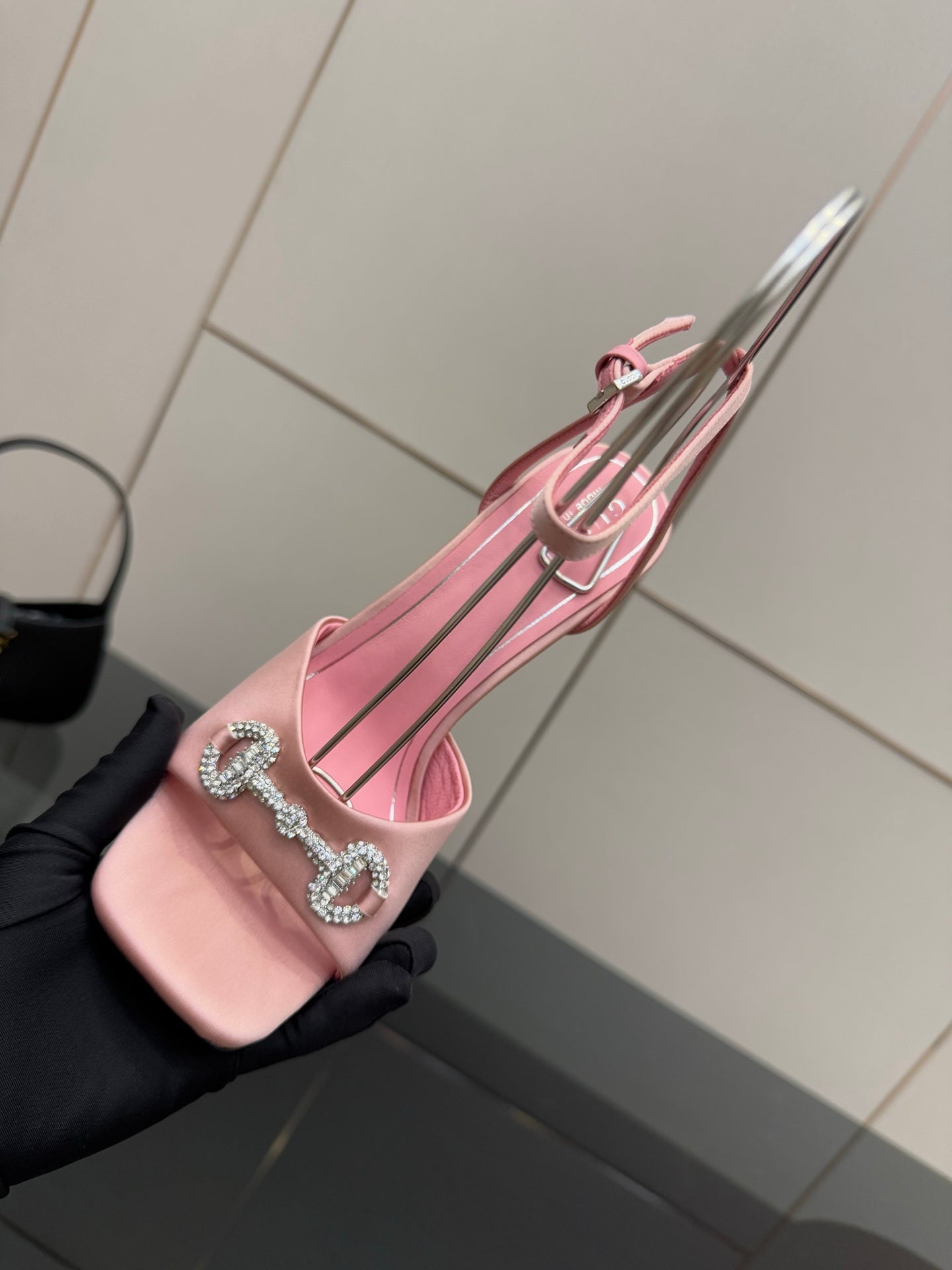 Gucci ladies pink open-toe heeled sandals with crystal buckle, tilted view