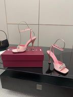 Gucci ladies pink heeled sandals with open toe and rhinestone buckle, side view