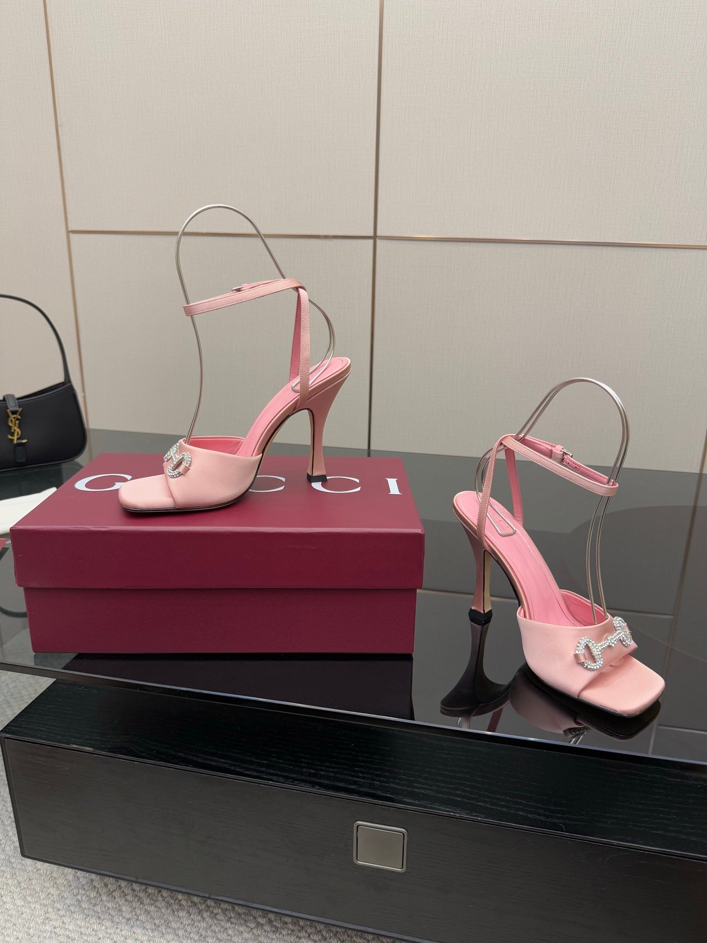 Gucci ladies pink heeled sandals with open toe and rhinestone buckle, side view