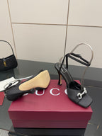 Gucci ladies black heeled sandals with silver-tone embellished buckle and stiletto heel