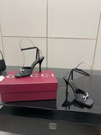 Gucci ladies black heeled sandals with silver-tone buckles and open-toe silhouette