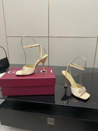 Cream stiletto heeled sandals with rhinestone strap and open toe
