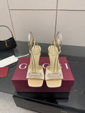 Cream slingback sandals with rhinestone embellishment and slim high heels
