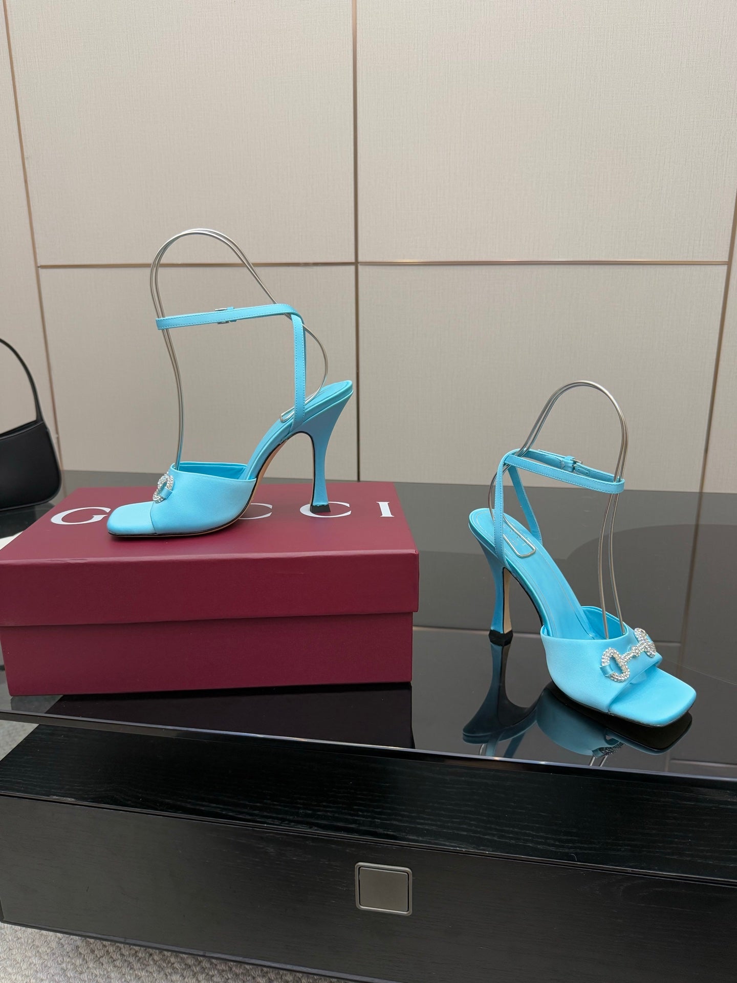 Women’s sky-blue heeled sandals with thin stiletto heel and ankle strap with charm