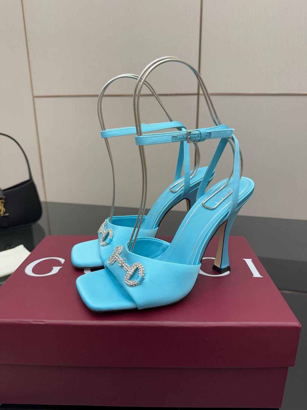 Women’s sky-blue open-toe heeled sandals with ankle strap and gold-tone chain charm
