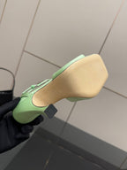 Green open-toe heeled sandal outsole view, footbed and heel