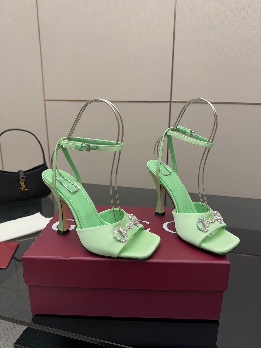 Green open-toe heeled sandals with slingback straps and silver-tone buckle detail