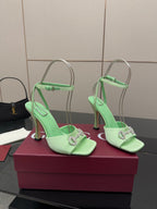 Green open-toe heeled sandals with slingback straps and silver-tone buckle detail