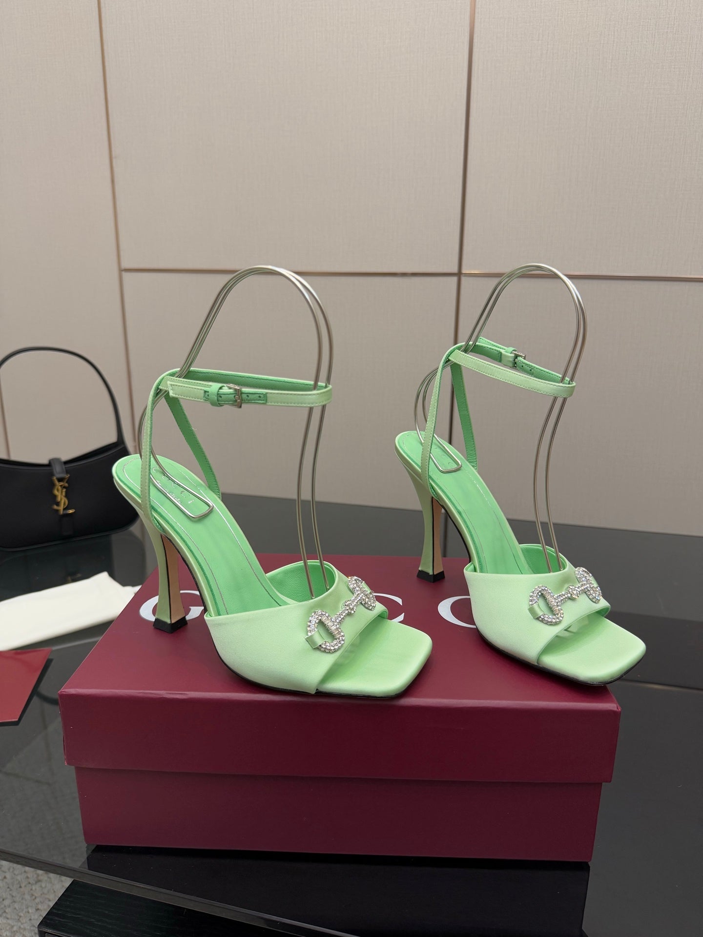 Green open-toe heeled sandals with slingback straps and silver-tone buckle detail
