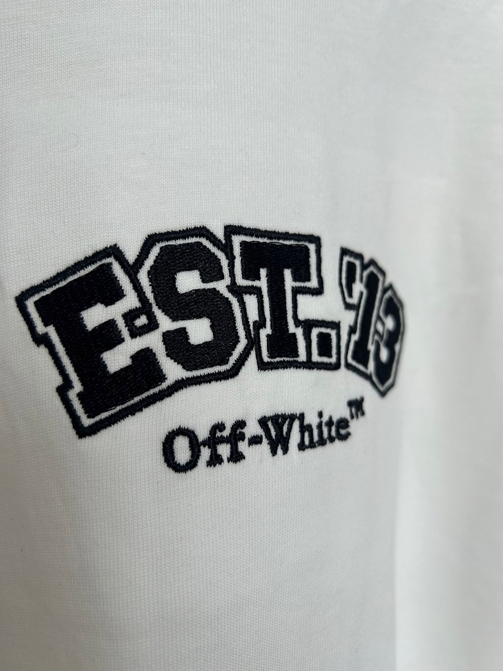 Off-White off-white T-shirt showing EST. 19 “Off-White” logo close-up