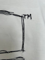 Off-white T-shirt back graphic detail with small “TM” text near top