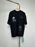 Black T-shirt with short sleeves and front graphic face print