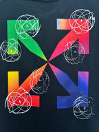 Black T-shirt closeup: colorful pinwheel graphic with white orbit line art