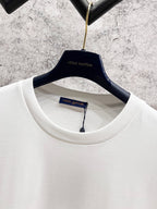 White T-shirt neckline with Louis Vuitton label and blue script logo