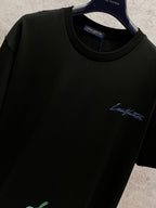 Black Louis Vuitton T-shirt with blue script logo and small pumpkin motif