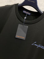 Black Louis Vuitton T-shirt neckline with hanging label and brand logo