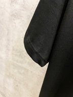 Black Louis Vuitton T-shirt sleeve cuff with visible seam detail