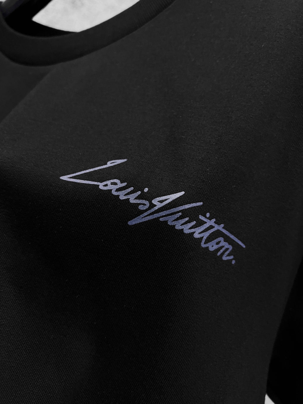 Black Louis Vuitton T-shirt with blue script logo on the chest