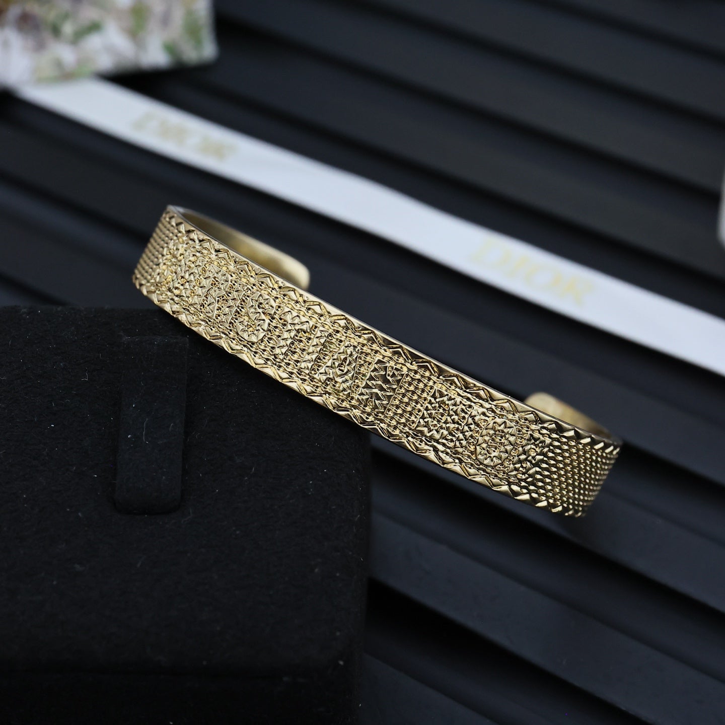 Dior gold-tone cuff bracelet with textured band and slim hinge bar